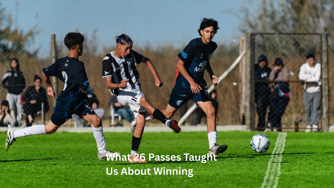 Soccer player passing the ball between two defenders